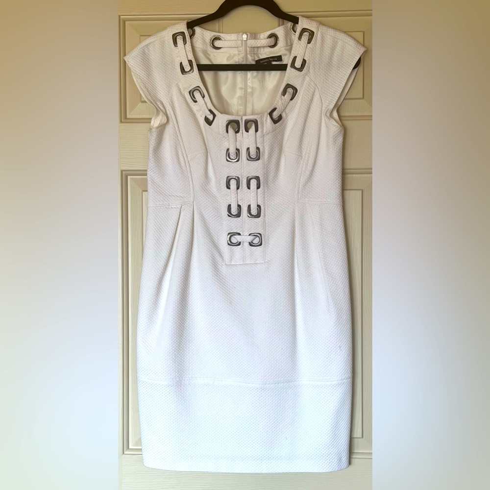 Nanette Lepore size 8 dress in white with grommet accents and pockets.